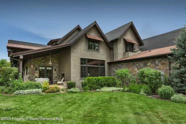 289 Sweetgrass Dr, Carbondale, CO 81623 - back of house with a lawn, a patio, stone siding, french doors, and stucco siding