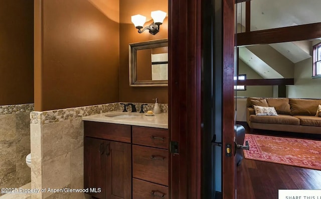 289 Sweetgrass Dr, Carbondale, CO 81623 - bathroom with wood finished floors, vanity, toilet, and ensuite bathroom