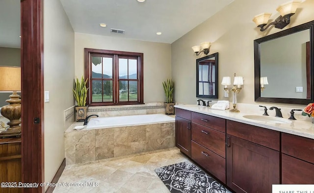 289 Sweetgrass Dr, Carbondale, CO 81623 - bathroom with a garden tub, double vanity, a sink, and visible vents