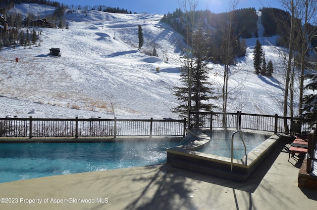 view of snow covered pool