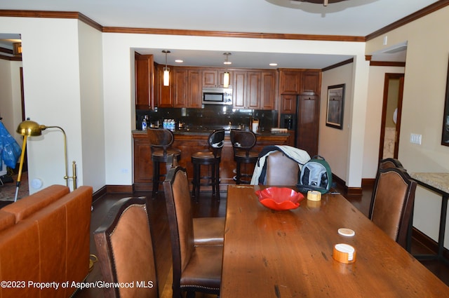 dining room featuring ornamental molding