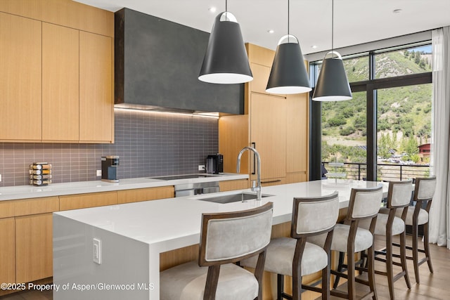45 Wood Rd Unit 403, Snowmass Village, CO 81615 - kitchen with modern cabinets, light countertops, and decorative backsplash