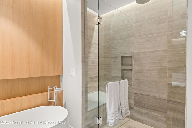 45 Wood Rd Unit 403, Snowmass Village, CO 81615 - bathroom featuring a shower stall and a freestanding bath