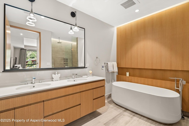 45 Wood Rd Unit 403, Snowmass Village, CO 81615 - full bath with a stall shower, double vanity, and a freestanding bath