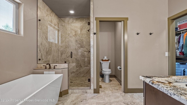 full bathroom featuring vanity, toilet, and shower with separate bathtub