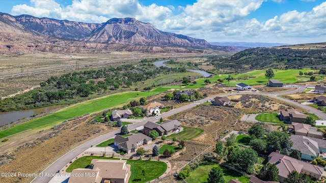 bird's eye view with a water and mountain view