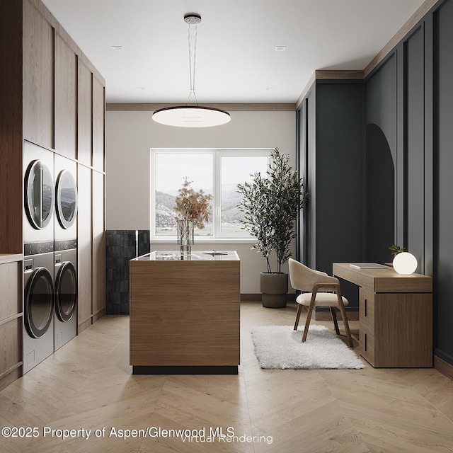 laundry room featuring washer and dryer and light parquet flooring