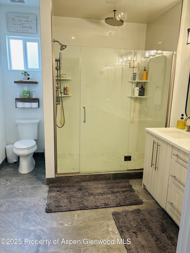 88 Green Mesa Pl, Parachute, CO 81635 - bathroom with a shower stall, baseboards, vanity, and toilet