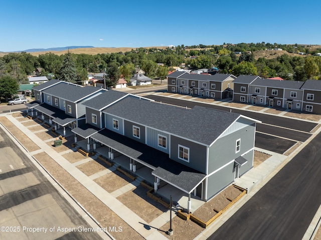 766 Tucker St, Craig, CO 81625 - aerial perspective of suburban area with a mountainous background