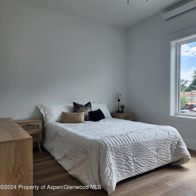 bedroom featuring hardwood / wood-style floors