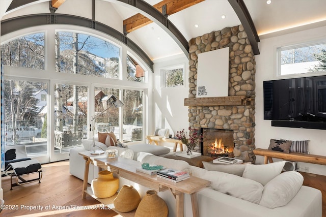 63 Smuggler Grove Rd, Aspen, CO 81611 - living room with a fireplace, beam ceiling, wood finished floors, and high vaulted ceiling