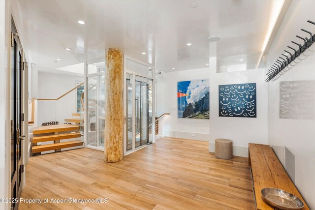 63 Smuggler Grove Rd, Aspen, CO 81611 - corridor with light wood finished floors and recessed lighting
