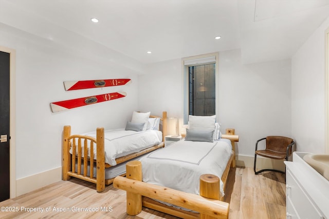 63 Smuggler Grove Rd, Aspen, CO 81611 - bedroom with wood finished floors and recessed lighting