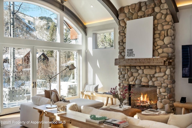63 Smuggler Grove Rd, Aspen, CO 81611 - living area with a fireplace, high vaulted ceiling, and arched walkways