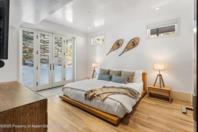 63 Smuggler Grove Rd, Aspen, CO 81611 - bedroom featuring access to exterior, light wood finished floors, recessed lighting, and french doors