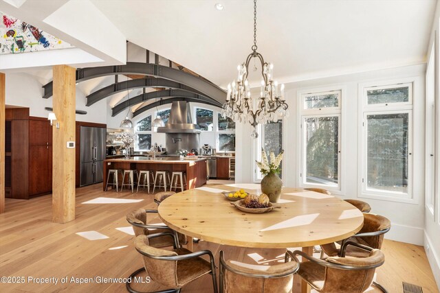 63 Smuggler Grove Rd, Aspen, CO 81611 - dining room with a chandelier and light wood-style floors