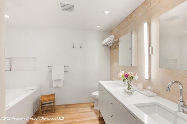 63 Smuggler Grove Rd, Aspen, CO 81611 - full bathroom with double vanity, a bathtub, wood finished floors, a shower, and recessed lighting