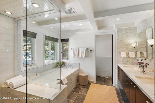 63 Smuggler Grove Rd, Aspen, CO 81611 - bathroom featuring tile walls, double vanity, a garden tub, coffered ceiling, and beamed ceiling