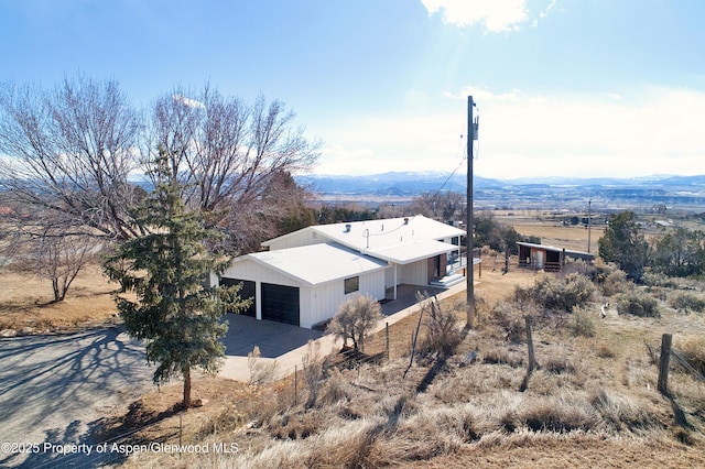 bird's eye view featuring a rural view and a mountain view