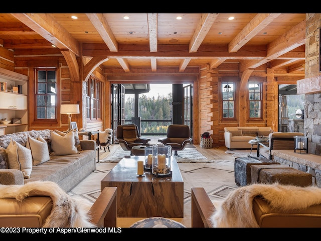 living room with beam ceiling, wooden ceiling, and a healthy amount of sunlight