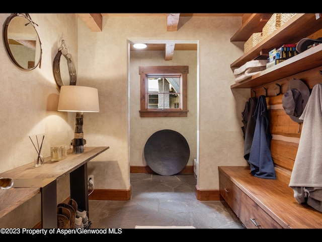 mudroom with beamed ceiling