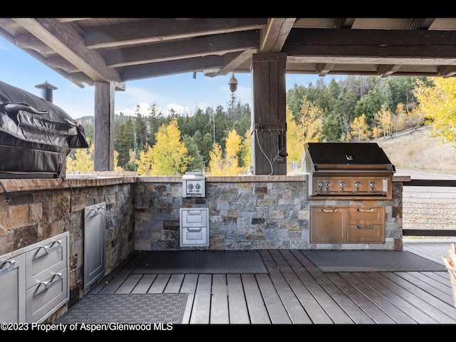 wooden deck with area for grilling