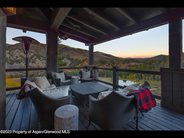 deck at dusk with a mountain view