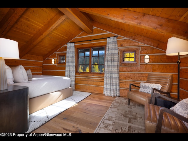 bedroom with lofted ceiling with beams, wooden walls, wood-type flooring, and wooden ceiling