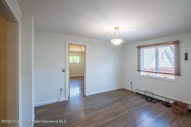 1105 Bennett Ave, Glenwood Springs, CO 81601 - spare room with wood finished floors and baseboard heating
