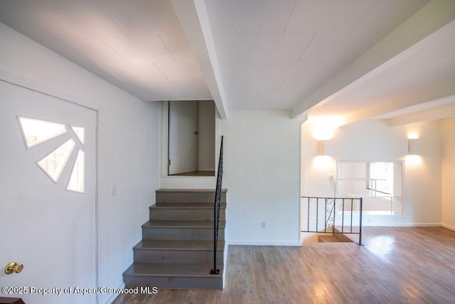 1105 Bennett Ave, Glenwood Springs, CO 81601 - staircase with wood finished floors and beamed ceiling