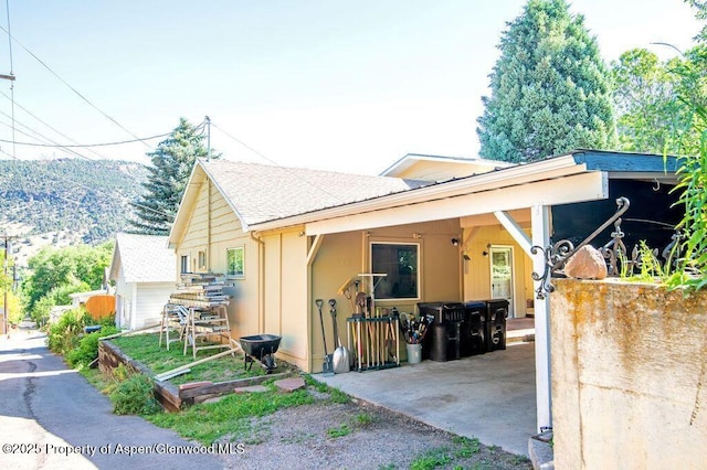 1105 Bennett Ave, Glenwood Springs, CO 81601 - view of front of property featuring stucco siding and a shingled roof