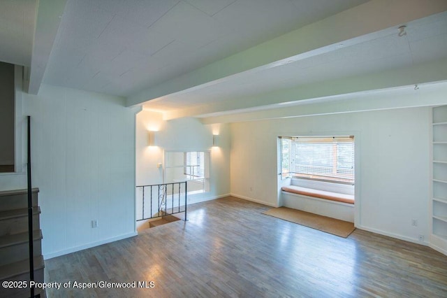 1105 Bennett Ave, Glenwood Springs, CO 81601 - spare room with wood finished floors and beam ceiling