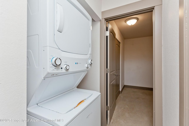 109 Anna Ct Unit B8, Grand Junction, CO 81503 - washroom with estacked washer and dryer and light carpet