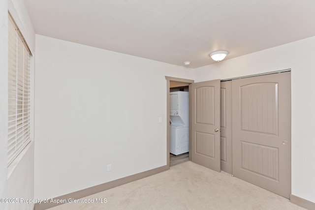 109 Anna Ct Unit B8, Grand Junction, CO 81503 - unfurnished bedroom with stacked washer / drying machine, carpet, and a closet