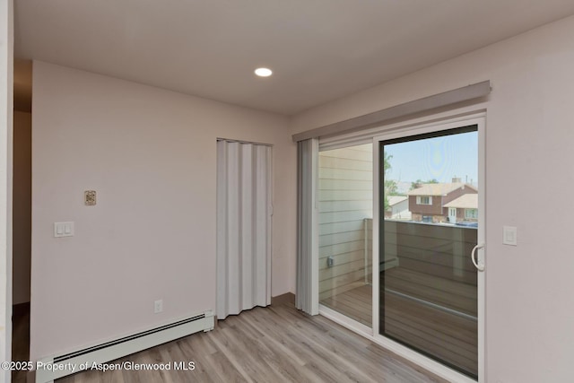 109 Anna Ct Unit B8, Grand Junction, CO 81503 - empty room with baseboard heating, light wood-style flooring, and recessed lighting