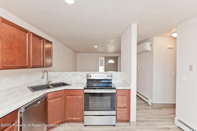 109 Anna Ct Unit B8, Grand Junction, CO 81503 - kitchen with appliances with stainless steel finishes, a baseboard heating unit, a wall mounted air conditioner, light wood finished floors, and recessed lighting