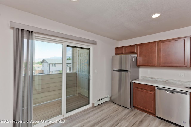 109 Anna Ct Unit B8, Grand Junction, CO 81503 - kitchen with stainless steel appliances, a baseboard radiator, light wood-style floors, light countertops, and recessed lighting