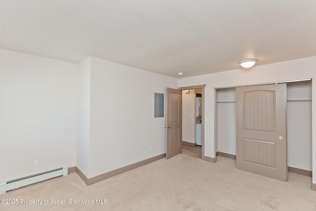 109 Anna Ct Unit B8, Grand Junction, CO 81503 - unfurnished bedroom featuring a baseboard radiator, light carpet, electric panel, a closet, and washer / dryer