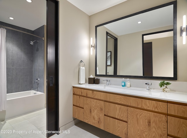 bathroom with shower / tub combo, vanity, and tile patterned floors