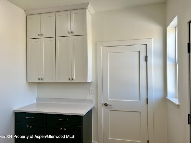 kitchen featuring white cabinetry