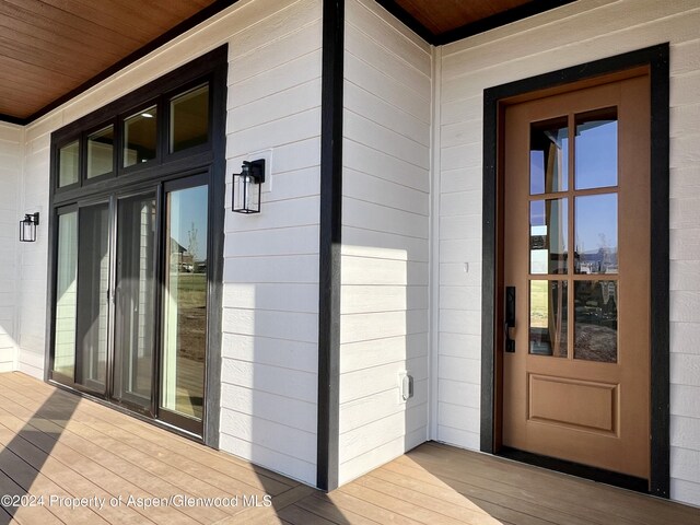 unfurnished room with ceiling fan, dark hardwood / wood-style floors, and a mountain view