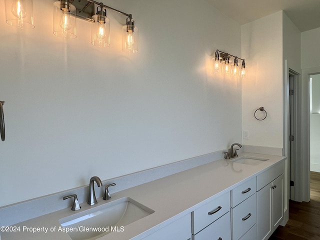 bathroom featuring hardwood / wood-style floors and vanity