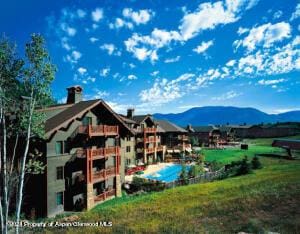 back of property with a mountain view