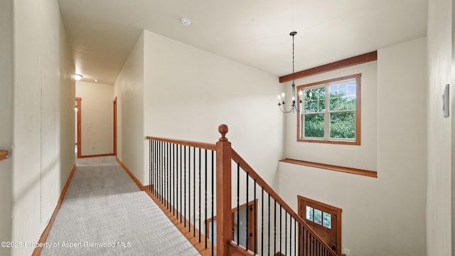 148 Laird Ln, Glenwood Springs, CO 81601 - hallway featuring an upstairs landing, a chandelier, and carpet