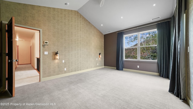 148 Laird Ln, Glenwood Springs, CO 81601 - unfurnished room with vaulted ceiling, light colored carpet, a smoke detector, and wallpapered walls