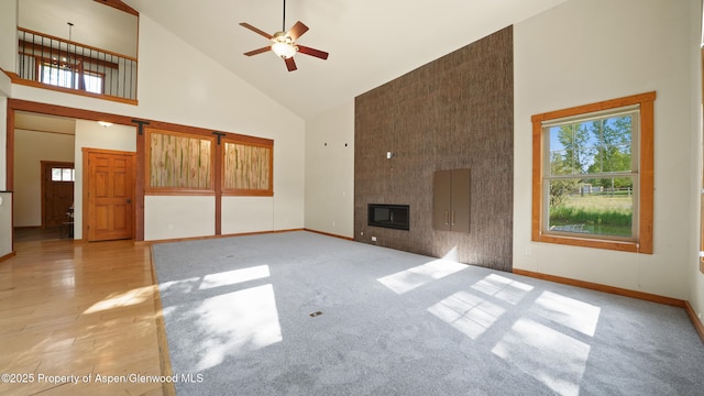 148 Laird Ln, Glenwood Springs, CO 81601 - unfurnished living room featuring high vaulted ceiling, a fireplace, and ceiling fan