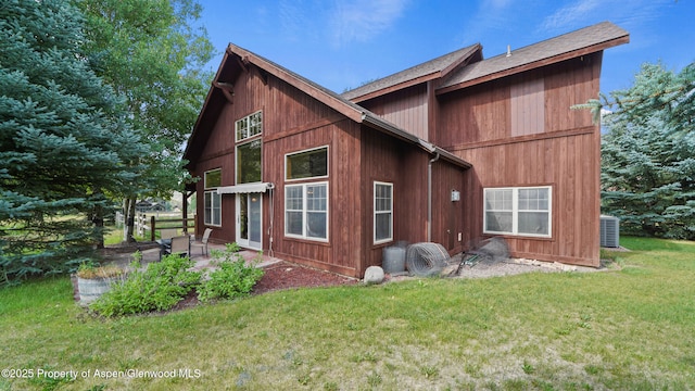148 Laird Ln, Glenwood Springs, CO 81601 - rear view of property with a lawn, a patio area, and a shingled roof