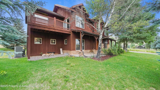 148 Laird Ln, Glenwood Springs, CO 81601 - back of house with a lawn, a patio area, a wooden deck, and stone siding