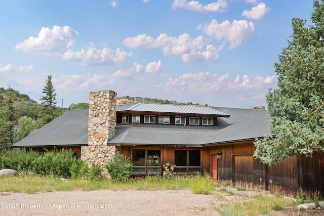 176 Letey Ln, Woody Creek, CO 81656 - back of property with roof with shingles and a chimney