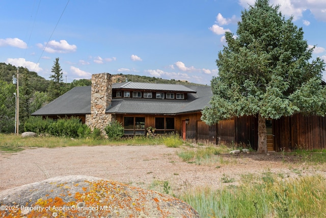 176 Letey Ln, Woody Creek, CO 81656 - back of house with a chimney and a shingled roof